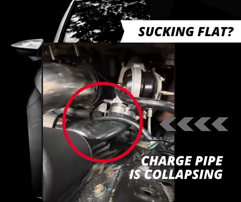 Collapsed turbo intake hose between air filter and turbocharger inlet showing vacuum deformation